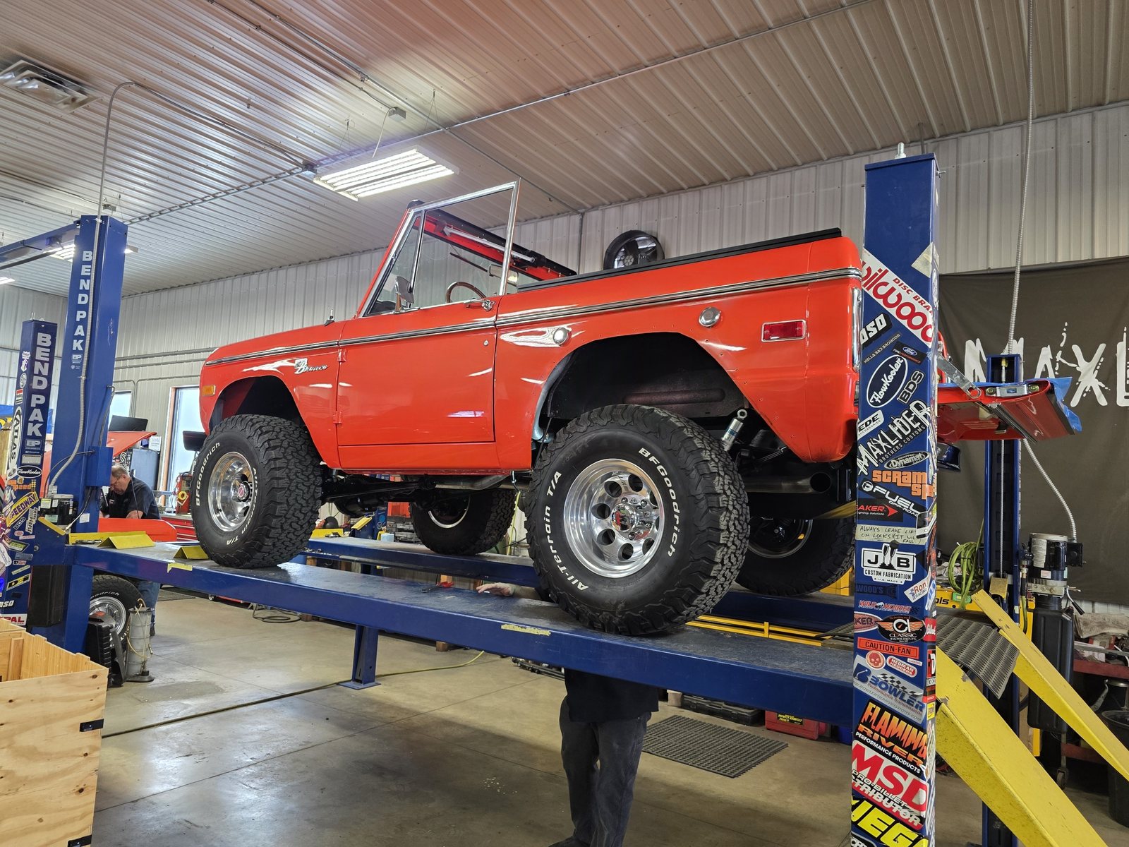 Bronco on the lift at Maxlider Brothers Customs